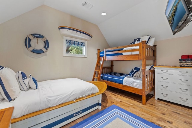 101 Matern Ct, Horseshoe Bay, TX 78657 - bedroom with lofted ceiling and wood finished floors