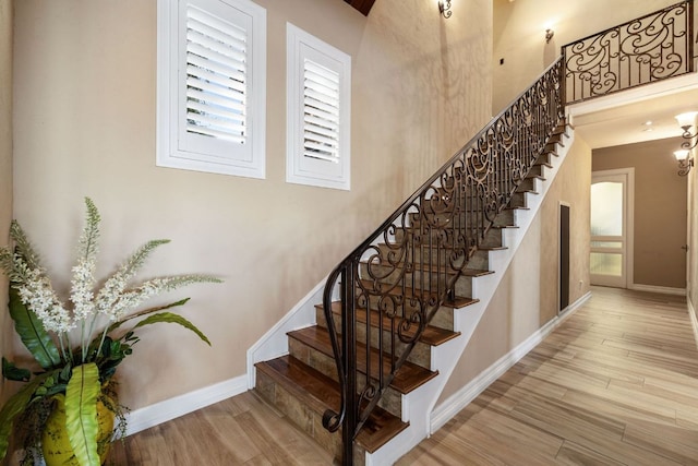 101 Matern Ct, Horseshoe Bay, TX 78657 - staircase with wood finished floors and baseboards