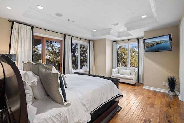 101 Matern Ct, Horseshoe Bay, TX 78657 - bedroom with a tray ceiling, crown molding, baseboards, light wood-type flooring, and recessed lighting