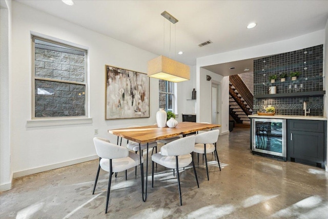133 Frederick St Unit A, Austin, TX 78704 - dining room featuring wine cooler, concrete floors, bar, recessed lighting, and stairway