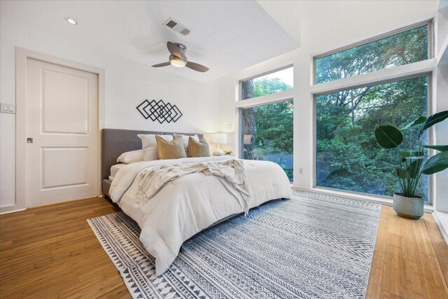 133 Frederick St Unit A, Austin, TX 78704 - bedroom with wood finished floors, ceiling fan, and access to exterior