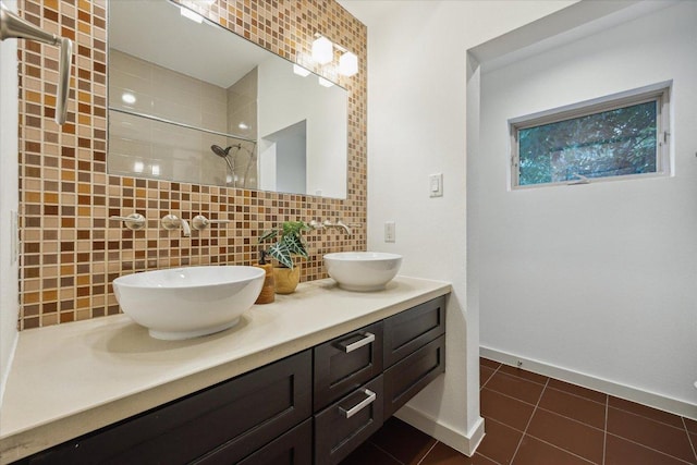 133 Frederick St Unit A, Austin, TX 78704 - bathroom with double vanity, tiled shower, backsplash, and tile patterned floors