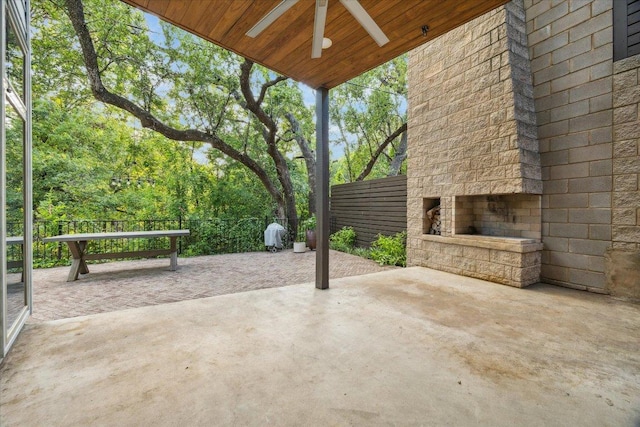 133 Frederick St Unit A, Austin, TX 78704 - view of patio with an outdoor stone fireplace and a ceiling fan