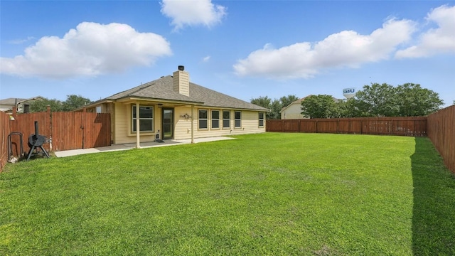 878 Avery Pkwy, New Braunfels, TX 78130 - back of house featuring a patio, a shingled roof, and a chimney