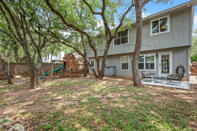 4019 Iriona Bnd, Austin, TX 78749 - fenced backyard featuring a playground and a patio