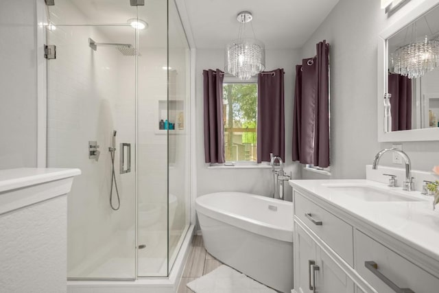 4019 Iriona Bnd, Austin, TX 78749 - full bathroom with a chandelier, a stall shower, vanity, and a soaking tub