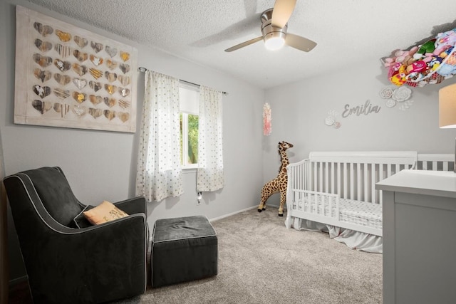 4019 Iriona Bnd, Austin, TX 78749 - bedroom with carpet flooring, a crib, ceiling fan, and a textured ceiling