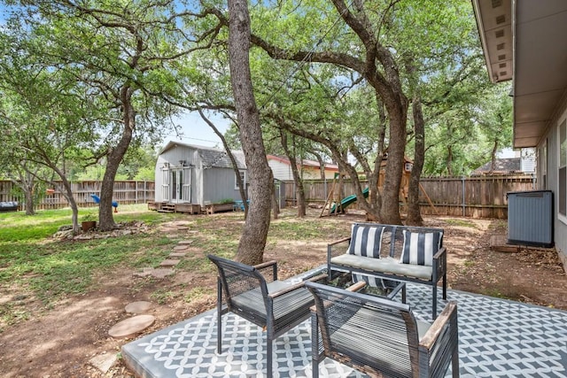 4019 Iriona Bnd, Austin, TX 78749 - fenced backyard featuring an outdoor structure, outdoor lounge area, and a patio area