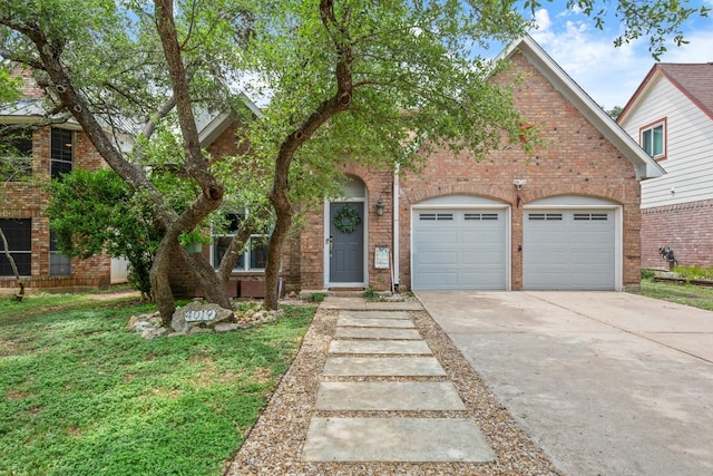 4019 Iriona Bnd, Austin, TX 78749 - view of front of house featuring concrete driveway, a garage, and brick siding
