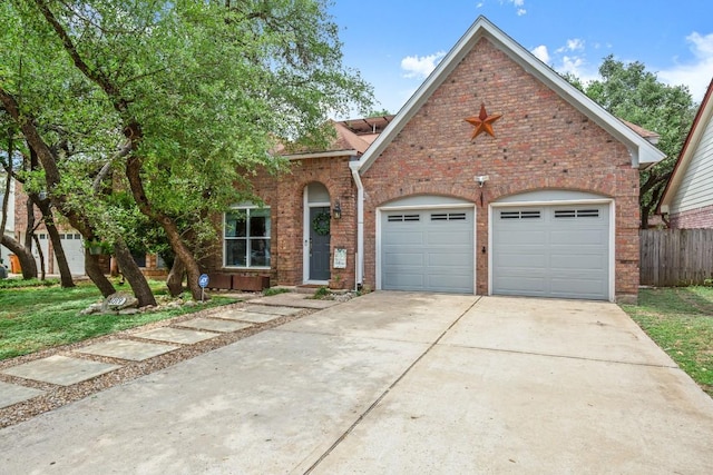 4019 Iriona Bnd, Austin, TX 78749 - view of front of house featuring concrete driveway, brick siding, and a garage