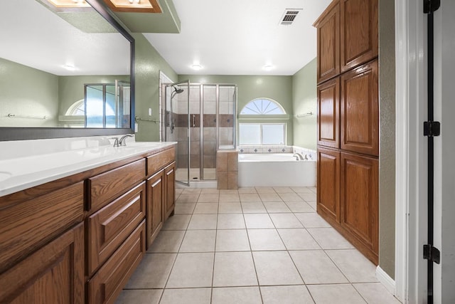 110 Starlight Trl, Georgetown, TX 78633 - bathroom with a shower stall, tile patterned floors, a garden tub, and vanity