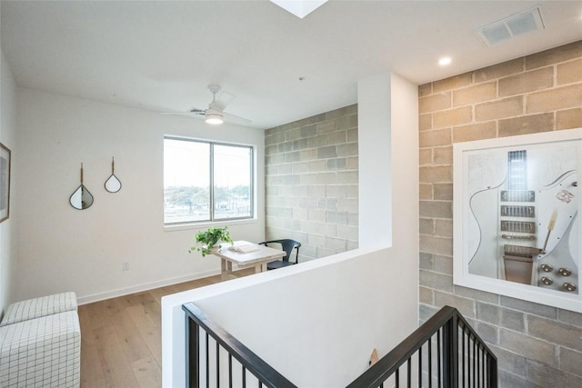 700 Denson Dr Unit 1101, Austin, TX 78752 - corridor with wood finished floors and baseboards