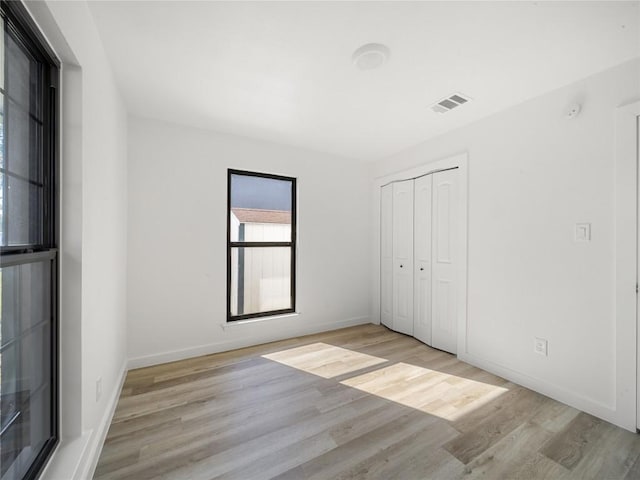 3912 Hillside Dr, Round Rock, TX 78681 - unfurnished bedroom with wood finished floors and a closet