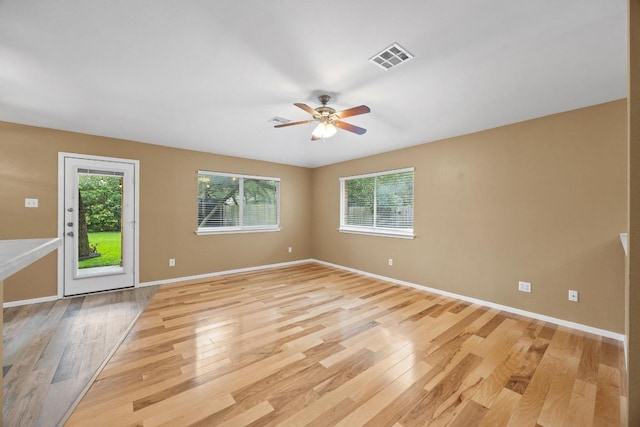 3817 Blue Mountain Path, Round Rock, TX 78681 - unfurnished room with light wood-style floors, plenty of natural light, and ceiling fan