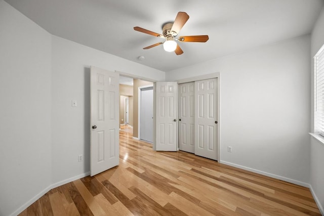3817 Blue Mountain Path, Round Rock, TX 78681 - unfurnished bedroom with light wood-style flooring, ceiling fan, and a closet
