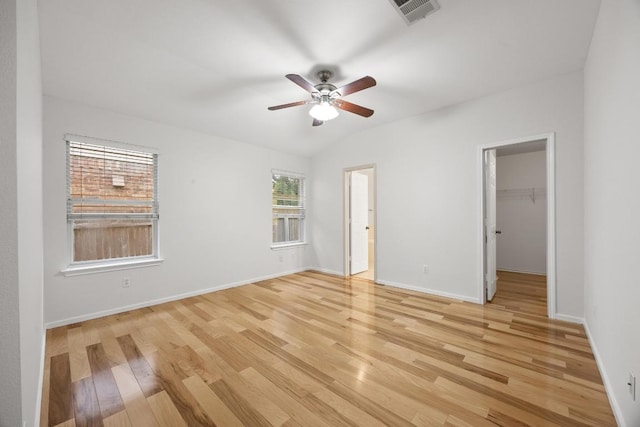 3817 Blue Mountain Path, Round Rock, TX 78681 - unfurnished bedroom with light wood finished floors, a walk in closet, and ceiling fan