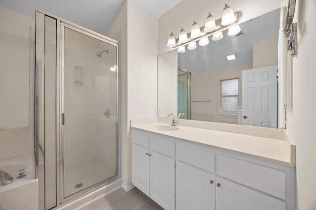 3817 Blue Mountain Path, Round Rock, TX 78681 - bathroom with a shower stall, vanity, and a garden tub