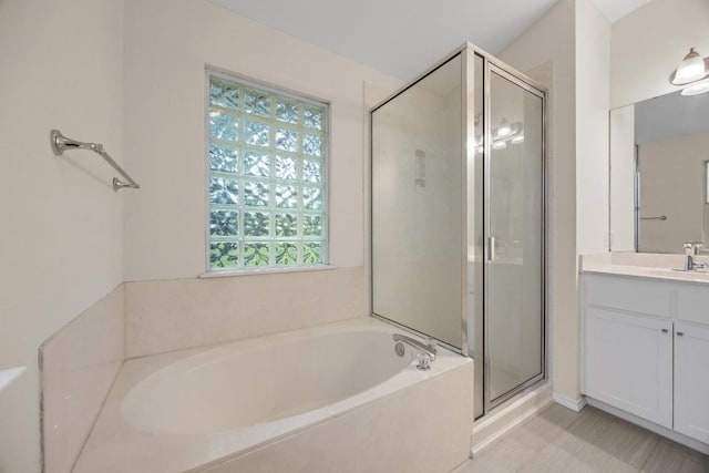 3817 Blue Mountain Path, Round Rock, TX 78681 - bathroom featuring vanity, a stall shower, and a garden tub