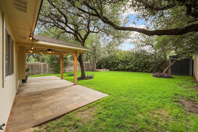 3817 Blue Mountain Path, Round Rock, TX 78681 - fenced backyard with a ceiling fan, a patio, and an outdoor structure