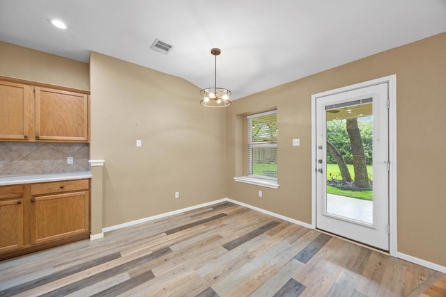 3817 Blue Mountain Path, Round Rock, TX 78681 - unfurnished dining area featuring light wood-type flooring, a chandelier, and recessed lighting