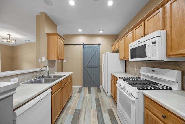 3817 Blue Mountain Path, Round Rock, TX 78681 - kitchen featuring white appliances, light wood-type flooring, tasteful backsplash, light countertops, and recessed lighting