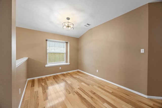 3817 Blue Mountain Path, Round Rock, TX 78681 - unfurnished room with light wood finished floors and a chandelier
