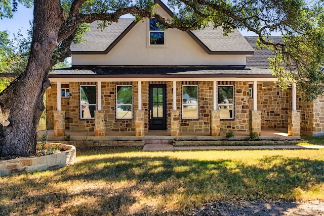 310 Shayla Ln, Canyon Lake, TX 78133 - view of front facade with a shingled roof, a porch, stone siding, and stucco siding
