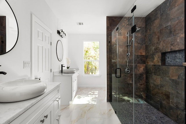 310 Shayla Ln, Canyon Lake, TX 78133 - full bathroom with a shower stall, two vanities, marble finish floors, and baseboards
