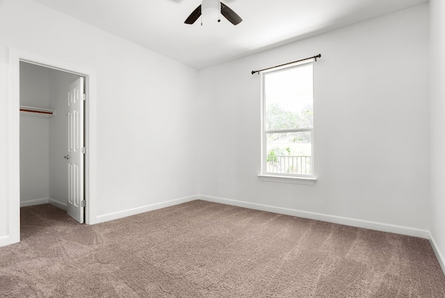 310 Shayla Ln, Canyon Lake, TX 78133 - unfurnished bedroom with carpet, baseboards, a spacious closet, and a closet
