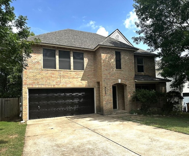 8429 Steamline Cir, Austin, TX 78745 - view of front of house with a garage, driveway, brick siding, and a shingled roof