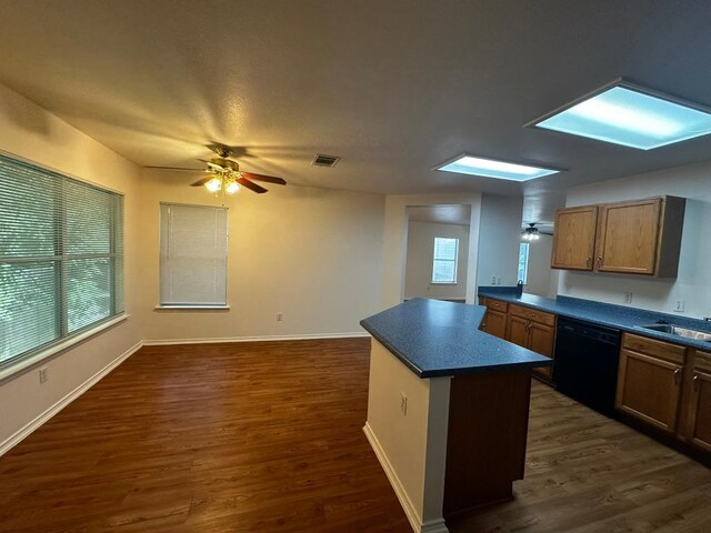 8429 Steamline Cir, Austin, TX 78745 - kitchen featuring black dishwasher, dark countertops, a ceiling fan, and dark wood finished floors