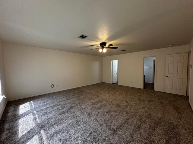8429 Steamline Cir, Austin, TX 78745 - unfurnished bedroom featuring carpet flooring and a ceiling fan