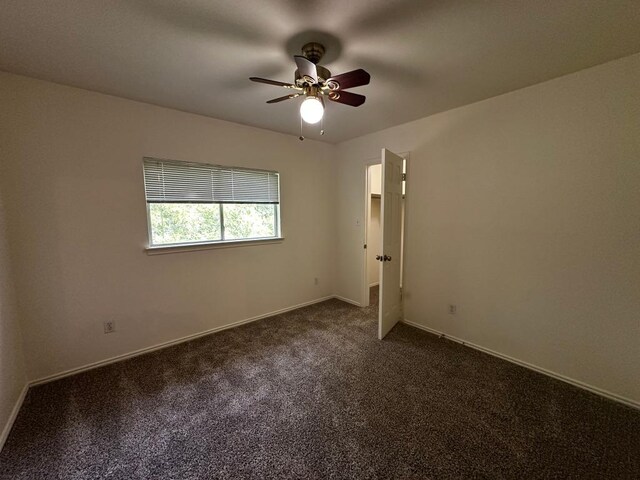 8429 Steamline Cir, Austin, TX 78745 - unfurnished room featuring ceiling fan, dark colored carpet, and baseboards
