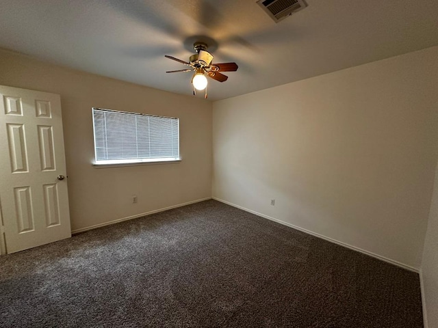 8429 Steamline Cir, Austin, TX 78745 - spare room with ceiling fan, dark carpet, and baseboards
