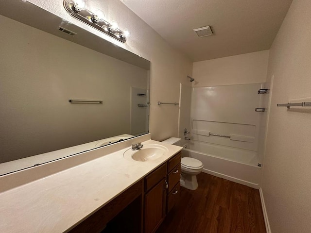 8429 Steamline Cir, Austin, TX 78745 - bathroom with wood finished floors, vanity, toilet, and shower / washtub combination