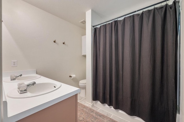 626 Goldenrod St, Kyle, TX 78640 - bathroom featuring toilet and double vanity