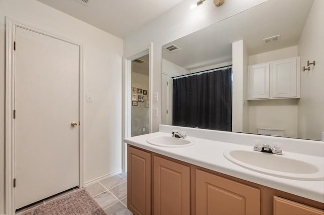 626 Goldenrod St, Kyle, TX 78640 - full bath featuring double vanity and curtained shower