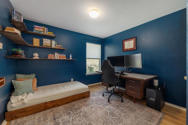 626 Goldenrod St, Kyle, TX 78640 - home office featuring wood finished floors and baseboards