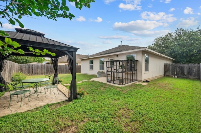 626 Goldenrod St, Kyle, TX 78640 - rear view of property with a gazebo, a patio area, and stucco siding