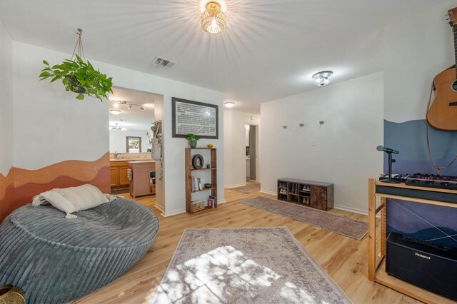 626 Goldenrod St, Kyle, TX 78640 - living area featuring light wood-style floors and baseboards