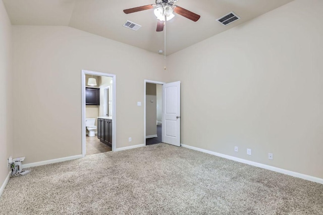 8521 White Ibis Dr, Austin, TX 78729 - unfurnished bedroom with carpet, lofted ceiling, ensuite bath, and a ceiling fan