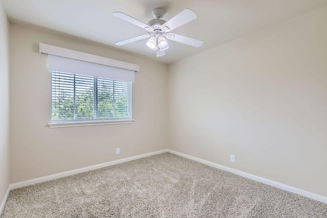 8521 White Ibis Dr, Austin, TX 78729 - carpeted spare room with baseboards and a ceiling fan