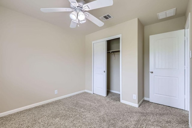 8521 White Ibis Dr, Austin, TX 78729 - unfurnished bedroom featuring carpet flooring, a closet, and a ceiling fan
