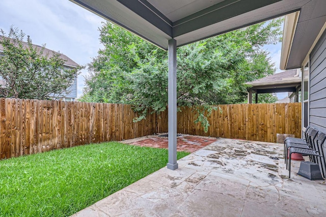 8521 White Ibis Dr, Austin, TX 78729 - fenced backyard featuring a patio