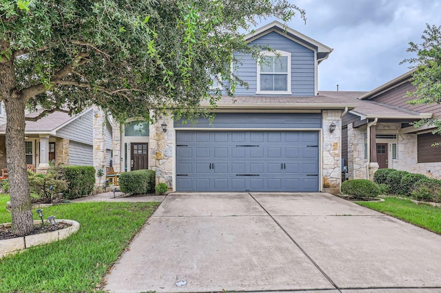 8521 White Ibis Dr, Austin, TX 78729 - view of front of home featuring stone siding, concrete driveway, a garage, and a front yard
