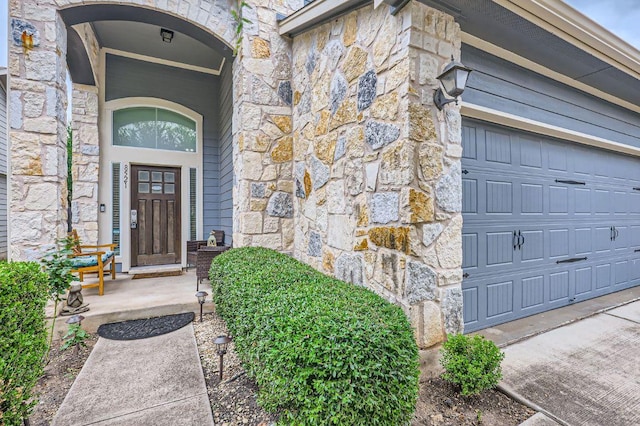 8521 White Ibis Dr, Austin, TX 78729 - property entrance with stone siding and a garage