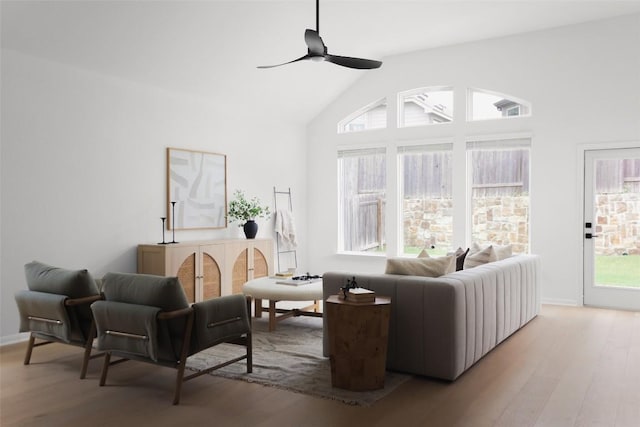 717 Sugar Cane Rd, Buda, TX 78610 - living room featuring wood finished floors, a ceiling fan, baseboards, and high vaulted ceiling