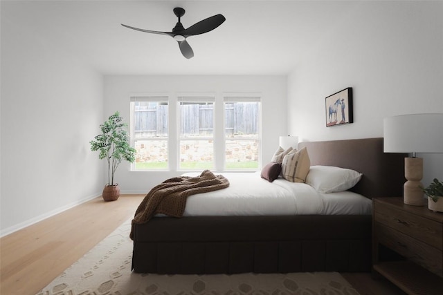 717 Sugar Cane Rd, Buda, TX 78610 - bedroom with wood finished floors, baseboards, and ceiling fan