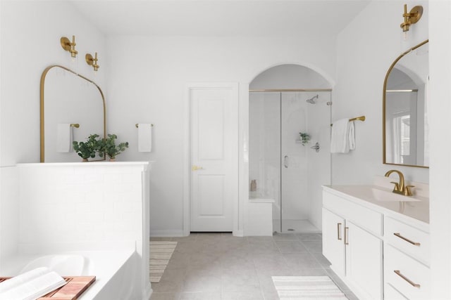 717 Sugar Cane Rd, Buda, TX 78610 - full bath with a shower stall, vanity, a garden tub, and tile patterned floors