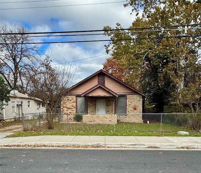 1218 E 52nd St, Austin, TX 78723 - view of front of property featuring brick siding and a fenced front yard